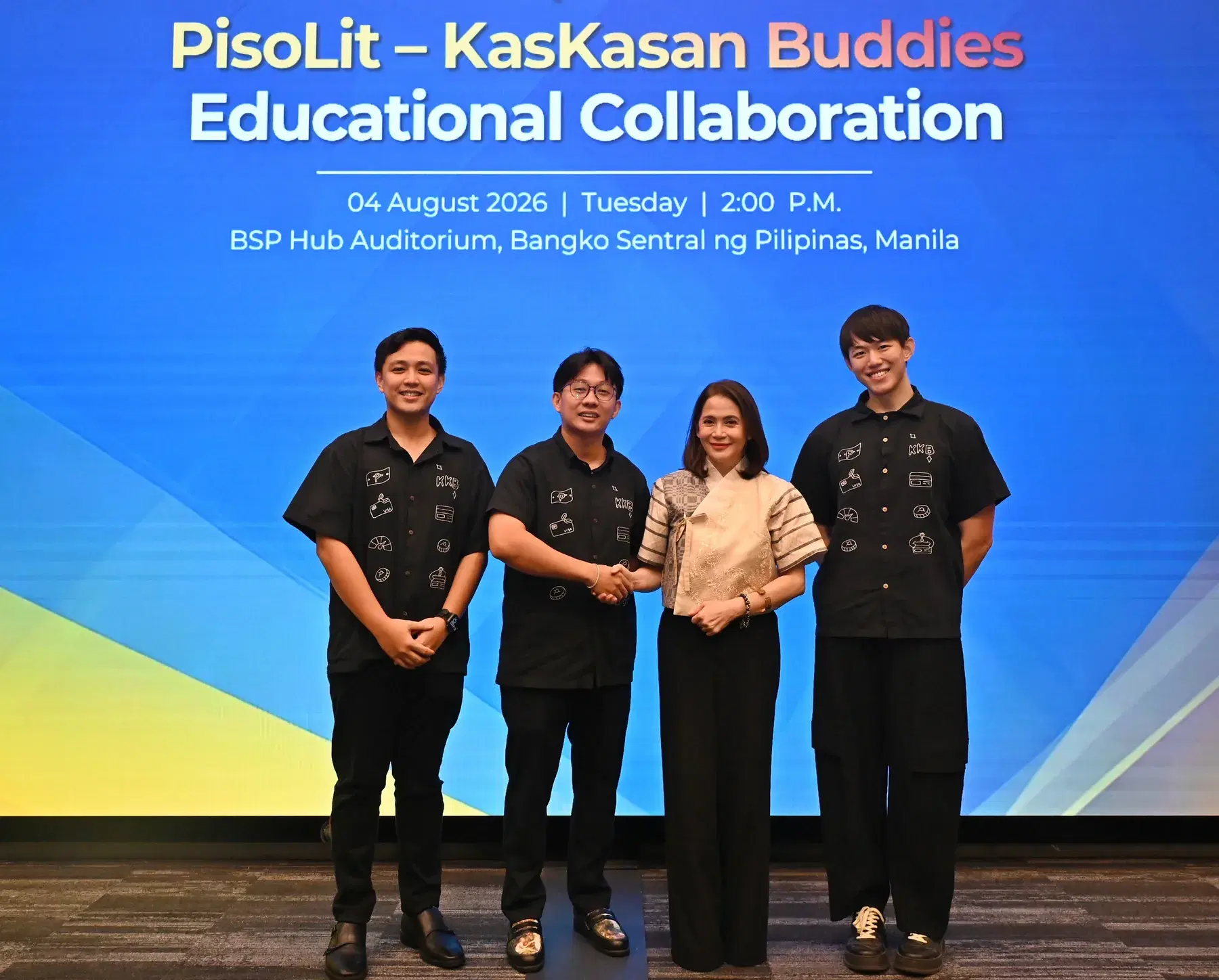 Four people on stage at the PisoLit–KasKasan Buddies educational collaboration event